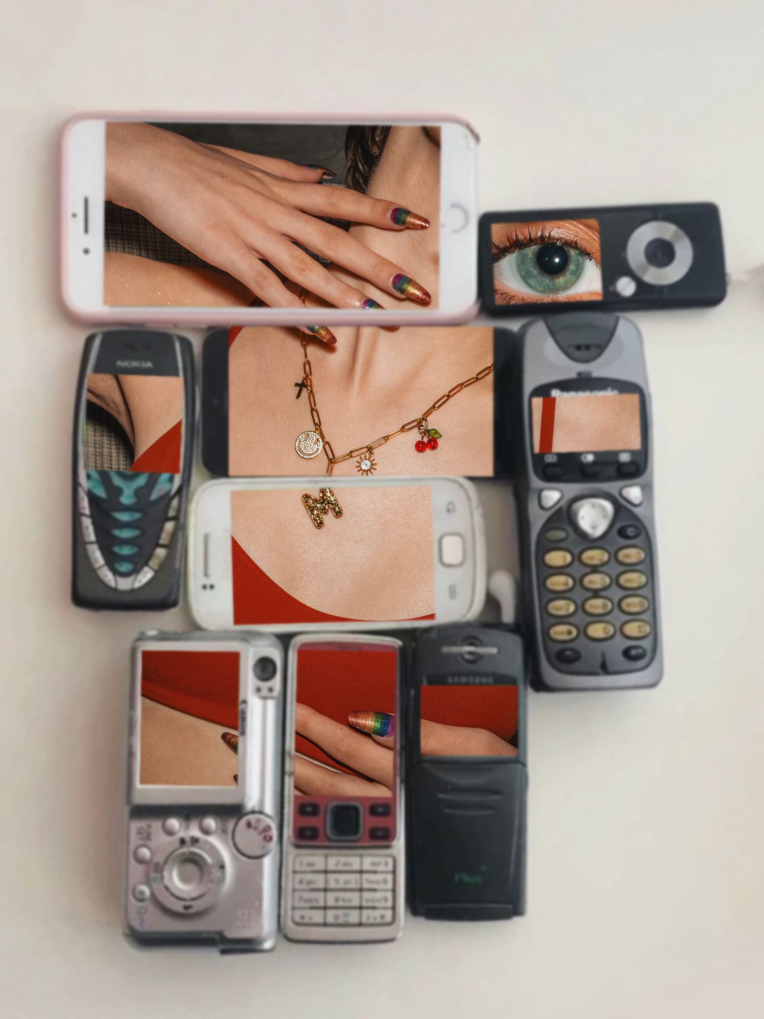 Collection of vintage and modern smartphones with various images on their screens.
