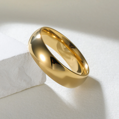 Gold ring with a black letter 'A' on a white background