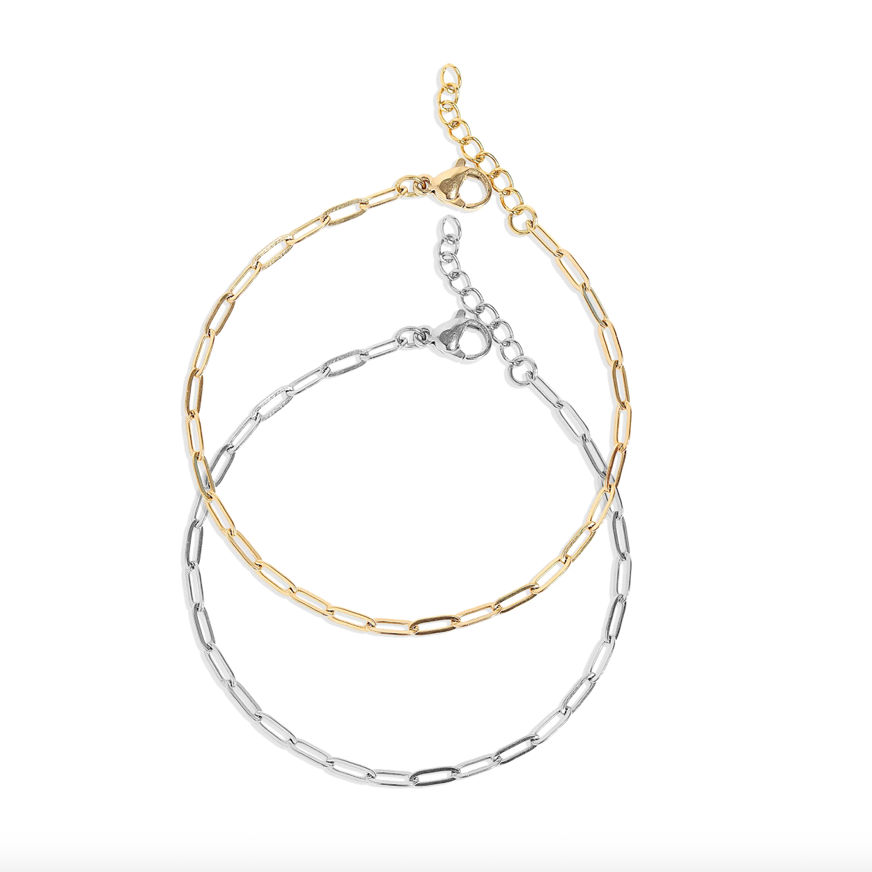 Two chain bracelets, one gold and one silver, on a white background.