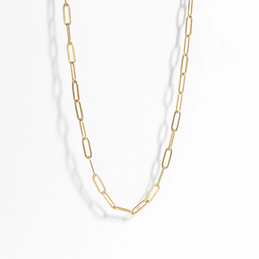 Gold chain necklace on a white background