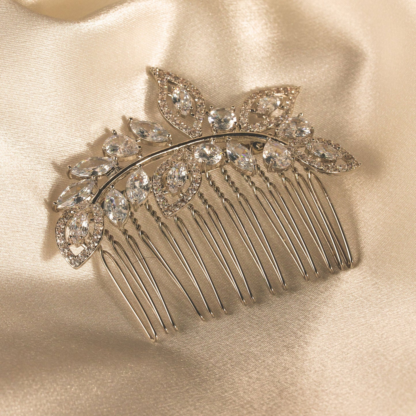 Decorative hair comb with crystals on a satin background