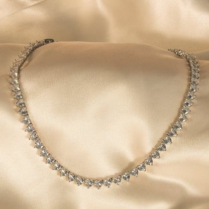 Diamanté necklace on a beige satin background