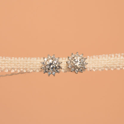 Pearl belt with silver embellishments on a beige background